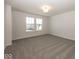 Spacious carpeted bedroom filled with sunlight coming through two large windows at 4991 Elaine Ct, Noblesville, IN 46062