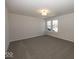 A large carpeted bedroom with lots of space and bright, natural light at 4991 Elaine Ct, Noblesville, IN 46062