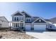 Beautiful two-story home with a manicured lawn, a two-car garage, and a covered front porch at 4991 Elaine Ct, Noblesville, IN 46062