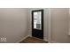Front door with sidelight and window allowing natural light to flow from the entrance at 4991 Elaine Ct, Noblesville, IN 46062