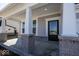 A front porch entrance to this house featuring large white columns with exposed brick detail at 4991 Elaine Ct, Noblesville, IN 46062