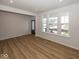 Bright living room with natural light, wood flooring, and neutral walls create an inviting atmosphere at 4991 Elaine Ct, Noblesville, IN 46062