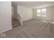 Inviting living room with plush carpeting, ample natural light, and neutral decor at 4991 Elaine Ct, Noblesville, IN 46062