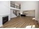 Spacious living room with a staircase leading to an upstairs area, flowing into the kitchen at 4991 Elaine Ct, Noblesville, IN 46062