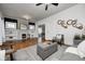 Cozy living room featuring a decorative fireplace, hardwood floors, and modern furniture at 610 N Drexel Ave, Indianapolis, IN 46201