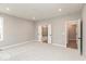 Spacious bedroom featuring plush carpeting, recessed lights, and doorways to a bathroom and hallway at 6973 Oakdale Ln, Avon, IN 46123