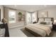 Serene bedroom with neutral tones, natural light, and stylish furnishings at 6973 Oakdale Ln, Avon, IN 46123