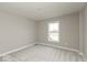 Bedroom with soft carpet, natural light from the window, and neutral paint at 6973 Oakdale Ln, Avon, IN 46123