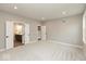 Expansive bedroom featuring soft carpet, recessed lighting, and open doorways to a bathroom and hallway at 6973 Oakdale Ln, Avon, IN 46123