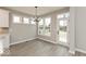 Bright dining area with chandelier, natural light, and a view of the backyard at 6973 Oakdale Ln, Avon, IN 46123