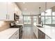 Gourmet kitchen featuring white cabinets, quartz countertops, island, and stainless steel appliances at 6973 Oakdale Ln, Avon, IN 46123