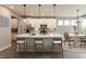 Bright, modern kitchen features white cabinetry, stainless steel appliances, and a large island with seating at 6973 Oakdale Ln, Avon, IN 46123