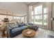 Spacious living room with high ceilings, large windows, and comfortable seating area at 6973 Oakdale Ln, Avon, IN 46123