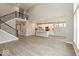 Open concept living room featuring a large kitchen, hardwood floors and modern stairs at 6973 Oakdale Ln, Avon, IN 46123