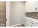 Walk-in pantry with storage shelves and cabinets for optimal organization at 6973 Oakdale Ln, Avon, IN 46123