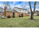 Spacious backyard featuring a patio area, mature trees, and a well-maintained lawn at 7330 Tousley Dr, Indianapolis, IN 46256