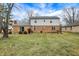 Home exterior with brick siding and a spacious grassy backyard at 7330 Tousley Dr, Indianapolis, IN 46256