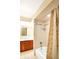 Bathroom boasts tub-shower combo with vanity and decoratively tiled wall at 7330 Tousley Dr, Indianapolis, IN 46256