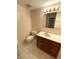 Bright bathroom featuring tile flooring, a vanity with a white countertop, and a standard toilet at 7330 Tousley Dr, Indianapolis, IN 46256