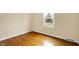 Bright bedroom featuring hardwood flooring and a window providing natural light at 7330 Tousley Dr, Indianapolis, IN 46256
