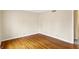 Bright bedroom with hardwood floors and neutral paint, ready for your personal touch at 7330 Tousley Dr, Indianapolis, IN 46256