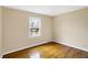 Bedroom featuring hardwood flooring and a window providing natural light at 7330 Tousley Dr, Indianapolis, IN 46256