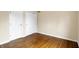 Bright bedroom featuring hardwood flooring, two closets for optimal storage and natural light at 7330 Tousley Dr, Indianapolis, IN 46256