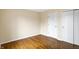 Bedroom features hardwood flooring with two closets for optimal storage space and natural light at 7330 Tousley Dr, Indianapolis, IN 46256