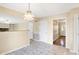 Inviting dining area features ceramic tile floors and open access to other rooms within the home at 7330 Tousley Dr, Indianapolis, IN 46256