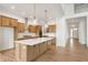 Modern kitchen featuring an island, stainless steel appliances, wooden cabinets, and pendant lighting at 770 Leila Mae Ln, Westfield, IN 46074