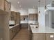 Modern kitchen featuring stainless steel appliances, white countertops, and a central island with pendant lights at 770 Leila Mae Ln, Westfield, IN 46074