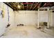 Unfinished basement area with exposed pipes and walls at 1715 Union St, Indianapolis, IN 46225