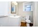 Clean bathroom with white vanity, toilet, and shower at 1715 Union St, Indianapolis, IN 46225