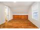 Bedroom featuring wood flooring, built-in storage, and a window at 1715 Union St, Indianapolis, IN 46225