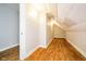Long attic storage space with wood floors and light fixtures at 1715 Union St, Indianapolis, IN 46225