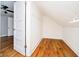 Spacious attic closet with wood flooring and built-in shelving at 1715 Union St, Indianapolis, IN 46225