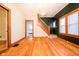 Bright dining area with hardwood floors and a staircase at 1715 Union St, Indianapolis, IN 46225