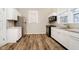 Bright kitchen with white cabinets, granite countertops, and stainless steel appliances at 1715 Union St, Indianapolis, IN 46225