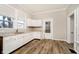 Spacious kitchen with white cabinets, granite countertops and wood flooring at 1715 Union St, Indianapolis, IN 46225