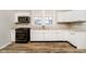 Modern kitchen boasting white cabinets, granite countertops, and dark appliances at 1715 Union St, Indianapolis, IN 46225