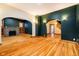 Open living room with hardwood floors, built-ins, and fireplace at 1715 Union St, Indianapolis, IN 46225