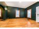 Living room features hardwood floors and an exterior door at 1715 Union St, Indianapolis, IN 46225