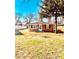 Cozy single-story brick home with a well-manicured lawn under a clear blue sky at 2245 Wallace Ave, Columbus, IN 47201