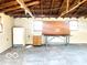 Spacious unfinished garage interior with exposed wooden beams, offering potential for customization at 2245 Wallace Ave, Columbus, IN 47201