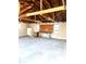 Spacious unfinished garage interior with exposed wooden beams, offering potential for customization at 2245 Wallace Ave, Columbus, IN 47201