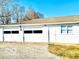 Detached two-car garage with white exterior, complemented by a gravel driveway at 2245 Wallace Ave, Columbus, IN 47201