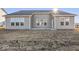 The home offers large windows to allow natural light, with a nice backyard awaiting landscaping at 310 N Bur Oak Dr, Mooresville, IN 46158