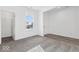 Bright, airy bedroom with plush carpeting, a closet, and a large window at 310 N Bur Oak Dr, Mooresville, IN 46158