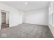 Spacious bedroom featuring plush carpeting, ample natural light, and a convenient walk-in closet at 310 N Bur Oak Dr, Mooresville, IN 46158