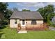 Charming single-story home featuring a cozy front deck and a well-maintained lawn at 6348 Kingsley Dr, Indianapolis, IN 46220